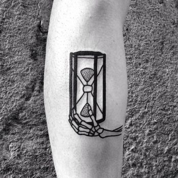 Skeleton hand and hourglass tattoo