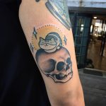 Skull and cat tattoo
