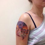 Sleeping fox tattoo on the arm