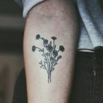 Small black flower bundle tattoo