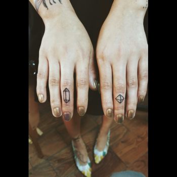 Small crystal tattoo on the finger