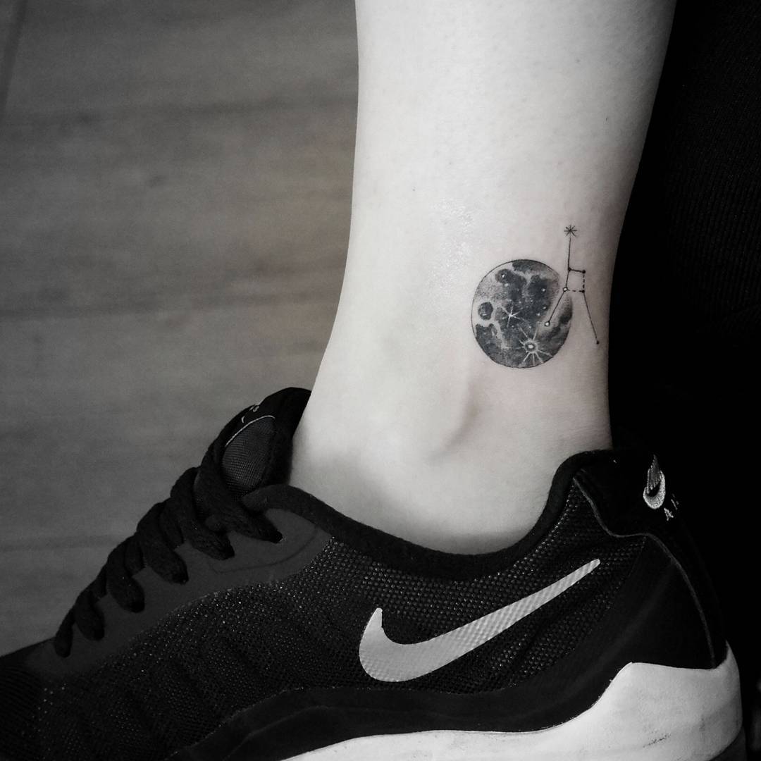 Small moon tattoo on the inner ankle