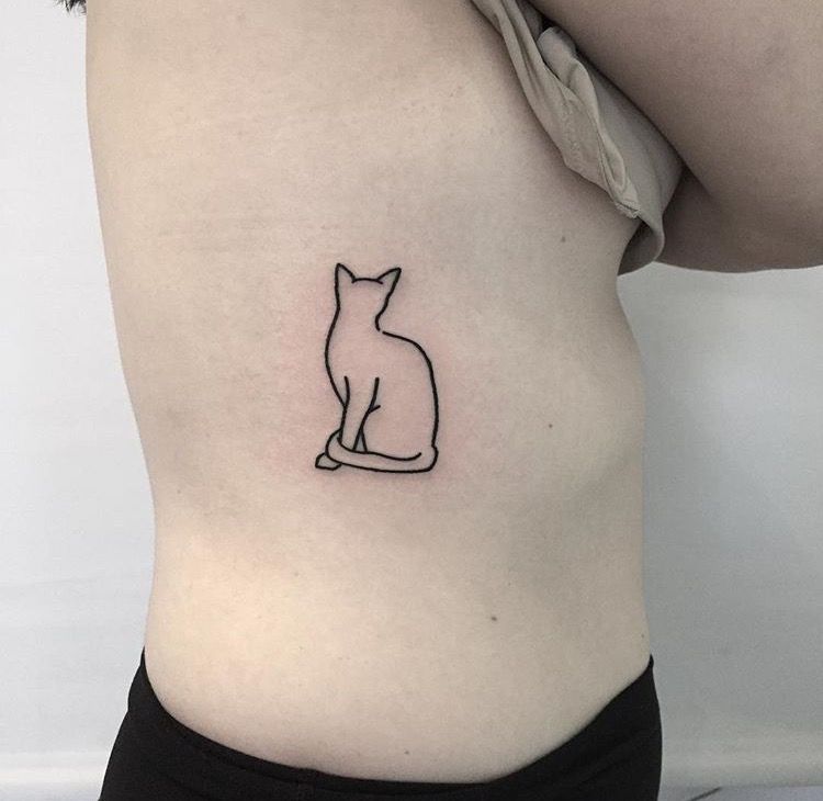 Small outline cat tattoo on the rib