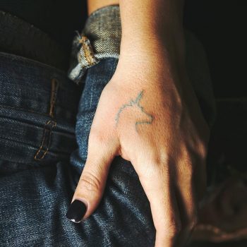Small outline unicorn head tattoo