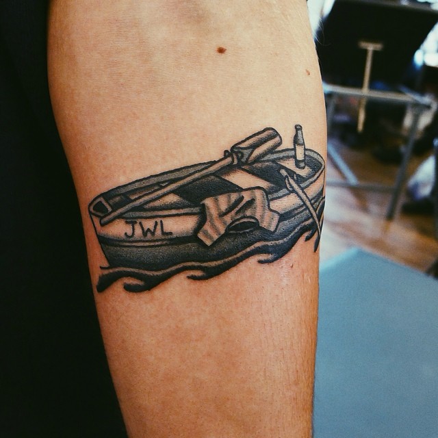 Small rowboat tattoo