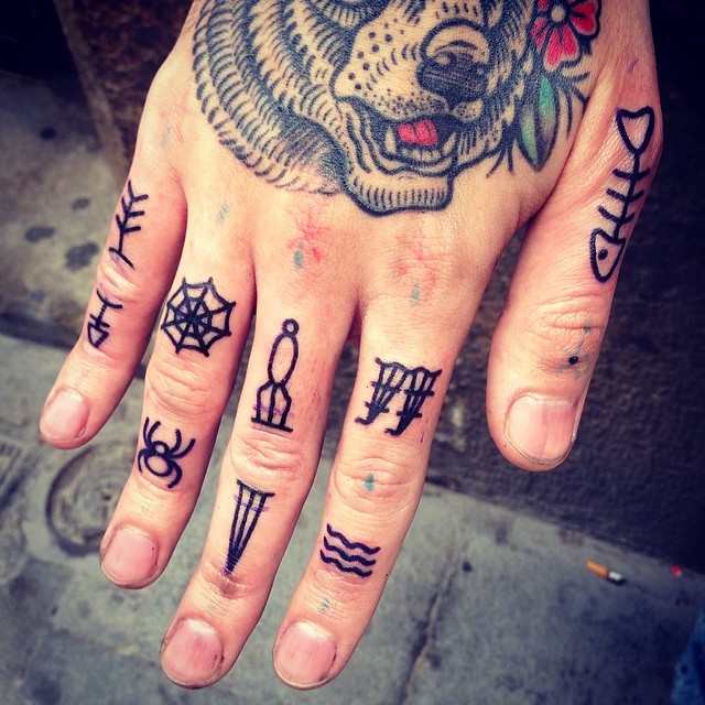 Small traditional finger tattoos