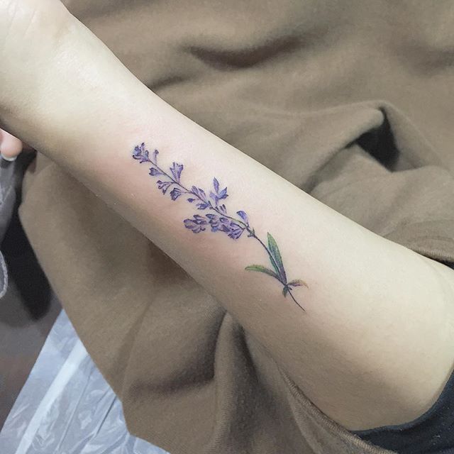 Small violet flower tattoo