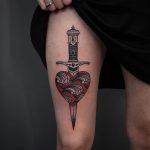 Stylized dagger stabbed heart tattoo