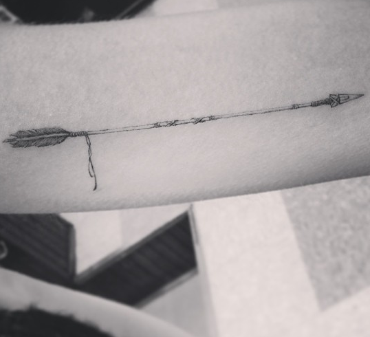 Thin arrow tattoo