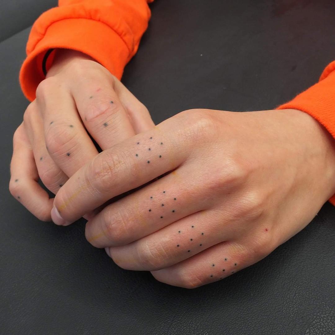Tiny geometric finger tattoos