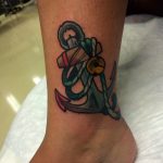Traditional anchor tattoo on the ankle