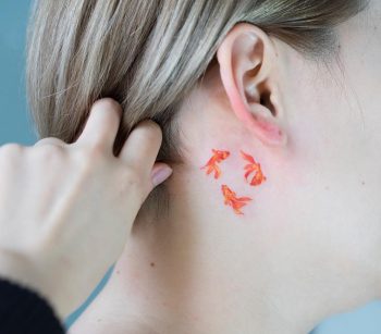 Triple gold fish tattoo
