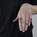 Two tattoos on fingers