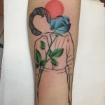 Woman silhouette and blue rose tattoo