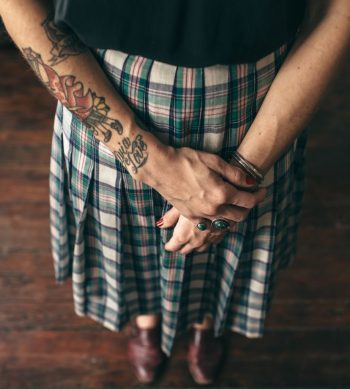 Word love inked on the wrist