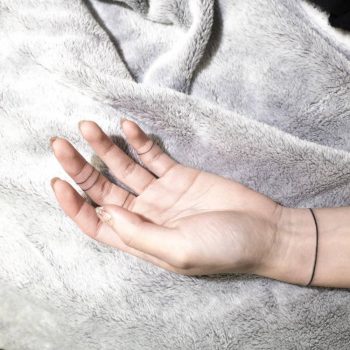 Wristband and ring tattoos