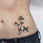 A delicate wildflower on the left hip