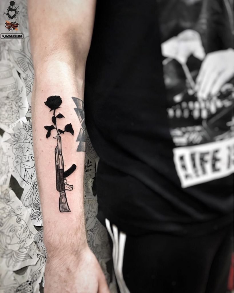 AK-47 and rose tattoo 