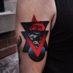 Abstract face and triangle tattoo