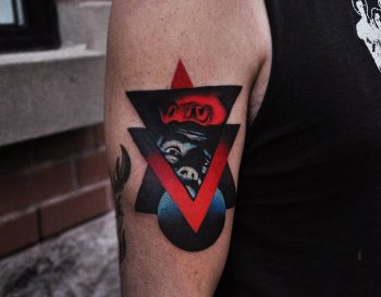 Abstract face and triangle tattoo