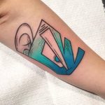 Abstract teal colored tattoo