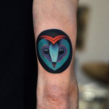 An owl head tattoo