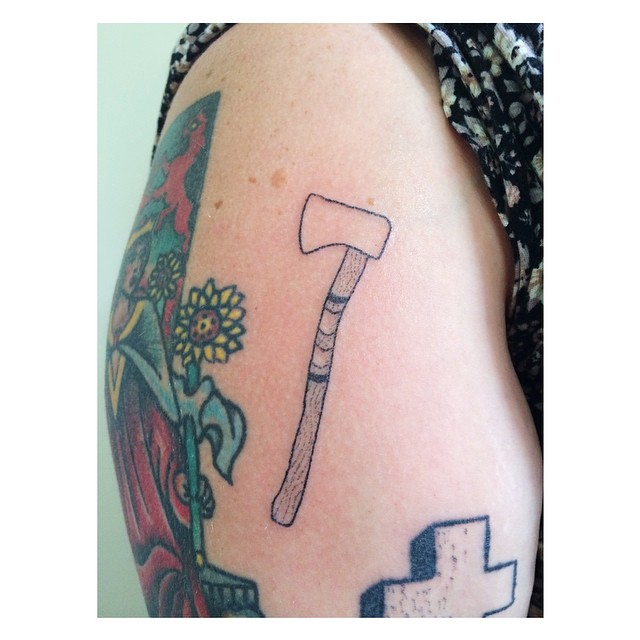 Axe tattoo on the right hip