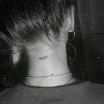 Baby tattoo on the back of the neck
