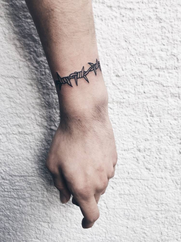 Barbed wire bracelet tattoo