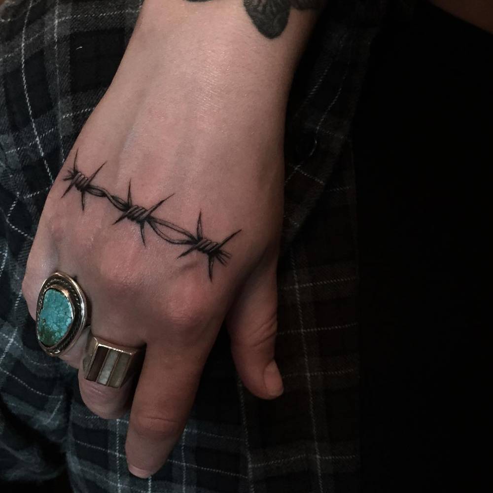 Barbed wire hand tattoo