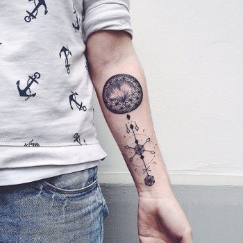 Black ginkgo leaf and ornament tattoo