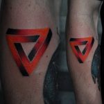 Black and red penrose triangle tattoo