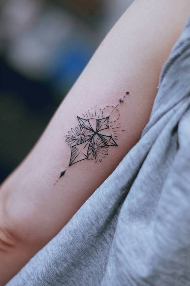 Black cross and flowers tattoo