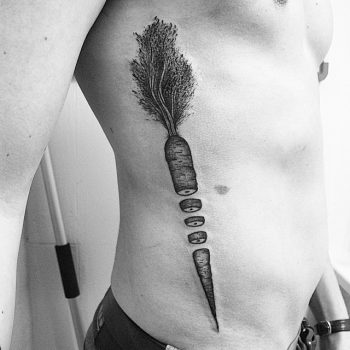 Black cut carrot tattoo