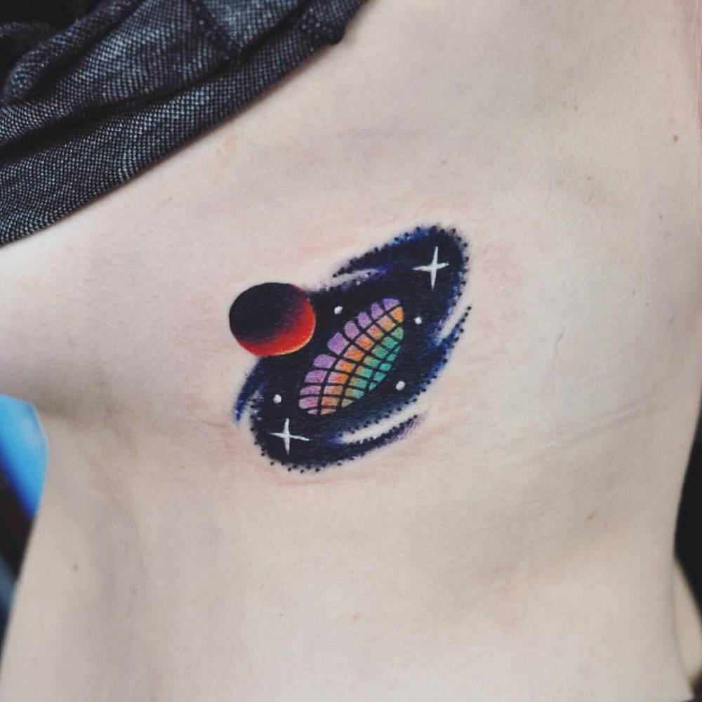 Black hole and a planet tattoo
