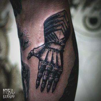 Black medieval gauntlet tattoo