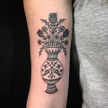 Black ornamental vase with flowers tattoo