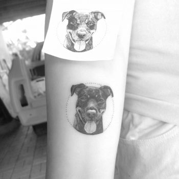 Black tattoo of a dog