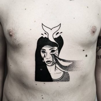 Black tattoo of a woman and whale tail
