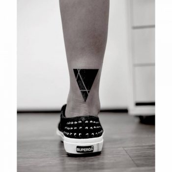 Black triangle tattoo with white lines