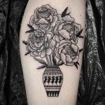 Black vase and flowers tattoo