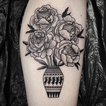 Black vase and flowers tattoo