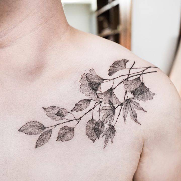 Branch with leaves tattoo on the shoulder
