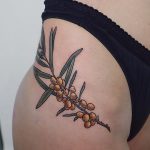 Branch with yellow berries tattoo