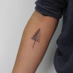 Christmas tree tattoo on the forearm