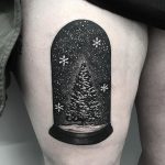 Christmas tree tattoo on the thigh