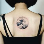 Circular great wave of kanagawa tattoo on the back