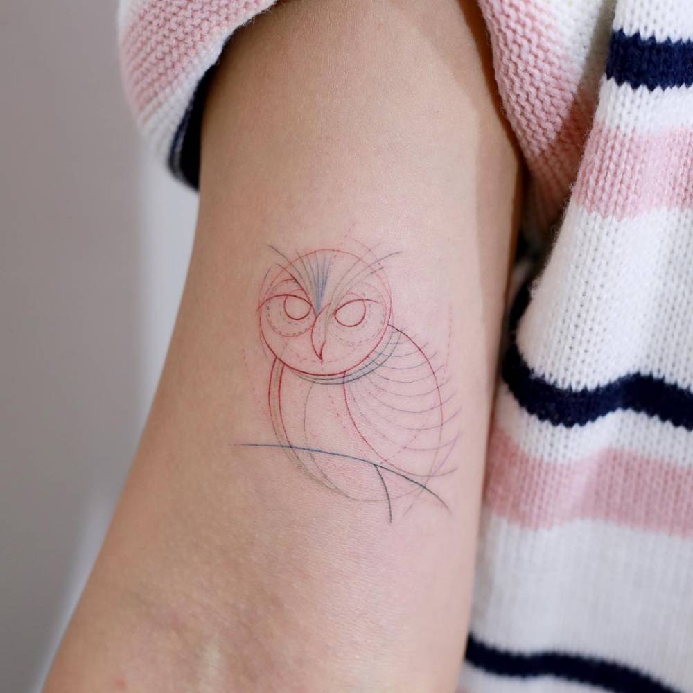 Circular owl tattoo