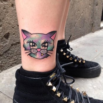 Colorful cat head tattoo