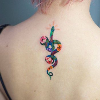 Colorful floral snake tattoo on the back